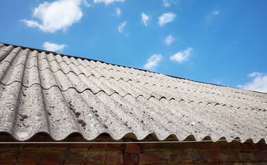 Picture of a roof made of carcinogenic asbestos tiles, selective focus. - 572394558