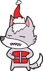 line drawing of a wolf with a gift wearing santa hat