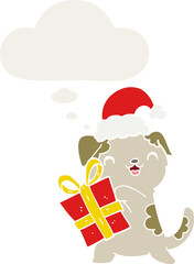 cute cartoon puppy with christmas present and hat and thought bubble in retro style