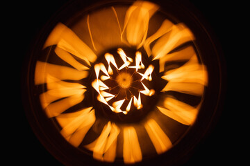 Abstract pattern of a tungsten lamp glowing in the dark,  close-up