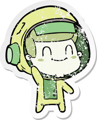distressed sticker of a happy cartoon astronaut man