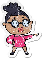 distressed sticker of a cartoon pointing woman wearing spectacles