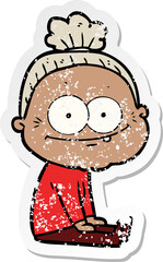 distressed sticker of a cartoon happy old woman