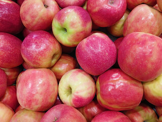 Background of fresh rose apples on a shop window. Group of objects