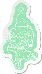 cartoon distressed sticker of a woman wearing santa hat