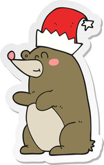 sticker of a cartoon bear wearing christmas hat