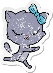 distressed sticker of a cute cartoon cat with bow