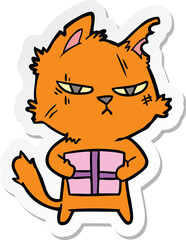 sticker of a tough cartoon cat with christmas present