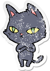 distressed sticker of a cartoon cat staring