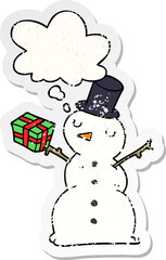 cartoon snowman and thought bubble as a distressed worn sticker