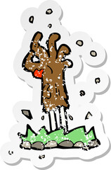 retro distressed sticker of a cartoon zombie hand rising from ground