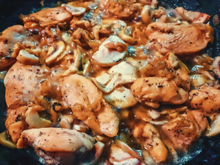 Healthy home made delicious chicken meat cooked with fresh mushrooms, onion and herbs, keto food,