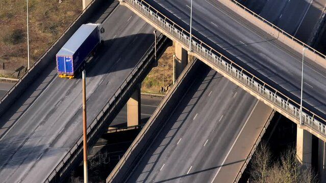 Rush Hour Vehicles Driving on a Motorway Interchange UK Aerial View
