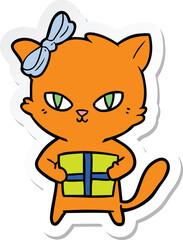 sticker of a cute cartoon cat with present