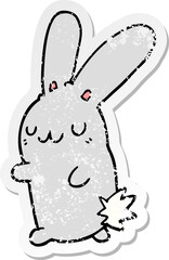 distressed sticker of a cute cartoon rabbit