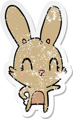 distressed sticker of a cute cartoon rabbit