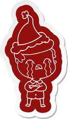 cartoon  sticker of a man crying wearing santa hat
