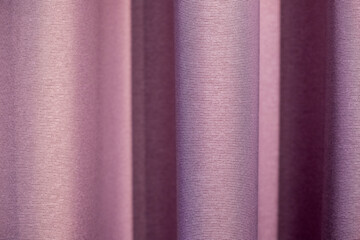 Top view of violet fabric cloth texture for background and design art work. Pink textile in fold surface backdrop.Drapery pink fabric background