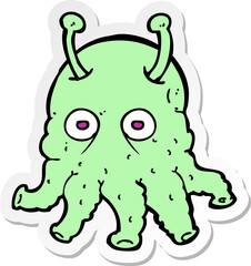 sticker of a cartoon space alien