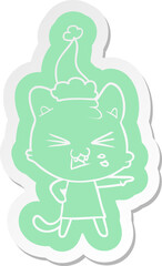 cartoon  sticker of a hissing cat wearing santa hat