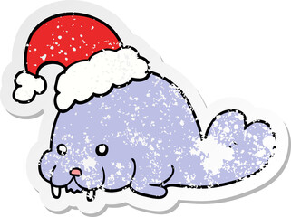 distressed sticker of a cartoon christmas walrus