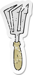 retro distressed sticker of a cartoon gardening tool