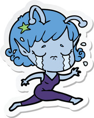 sticker of a cartoon crying alien girl