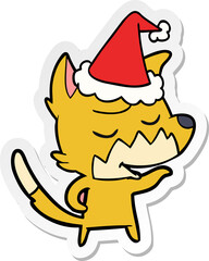 friendly sticker cartoon of a fox wearing santa hat