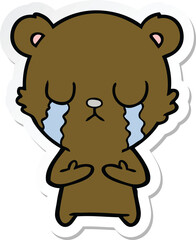 sticker of a crying cartoon bear