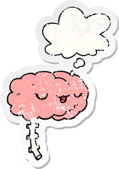 happy cartoon brain and thought bubble as a distressed worn sticker