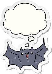 cartoon happy vampire bat and thought bubble as a printed sticker