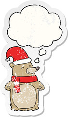 cartoon christmas bear and thought bubble as a distressed worn sticker