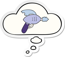cartoon ray gun and thought bubble as a printed sticker