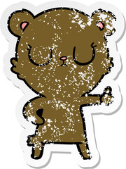 distressed sticker of a peaceful cartoon bear cub