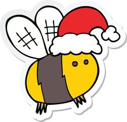 sticker of a cute cartoon bee wearing christmas hat