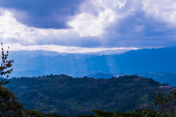 Sunbeams in a hilly landscape. Santander, Colombia.