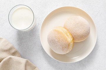 Berliner donut. Traditional german donut with raspberry jam, dusted with icing sugar. Top view
