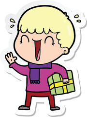 sticker of a laughing cartoon man with present