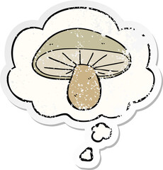 cartoon mushroom and thought bubble as a distressed worn sticker