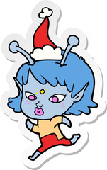 pretty sticker cartoon of a alien girl running wearing santa hat