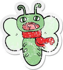 distressed sticker of a funny cartoon butterfly