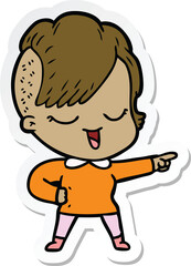 sticker of a happy cartoon girl pointing