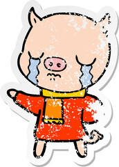 distressed sticker of a cartoon crying pig wearing scarf