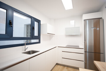 Fototapeta na wymiar perfectly equipped modern kitchen in a home