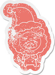 cartoon distressed sticker of a lion wearing santa hat