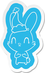 cute cartoon  sticker of a rabbit wearing santa hat