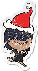 annoyed distressed sticker cartoon of a girl wearing santa hat