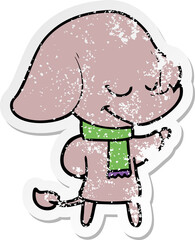 distressed sticker of a cartoon smiling elephant wearing scarf