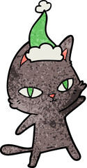 textured cartoon of a cat staring wearing santa hat