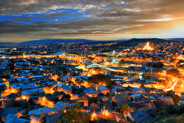 Picturesque skyline of the city of Tbilisi in the evening at sunset